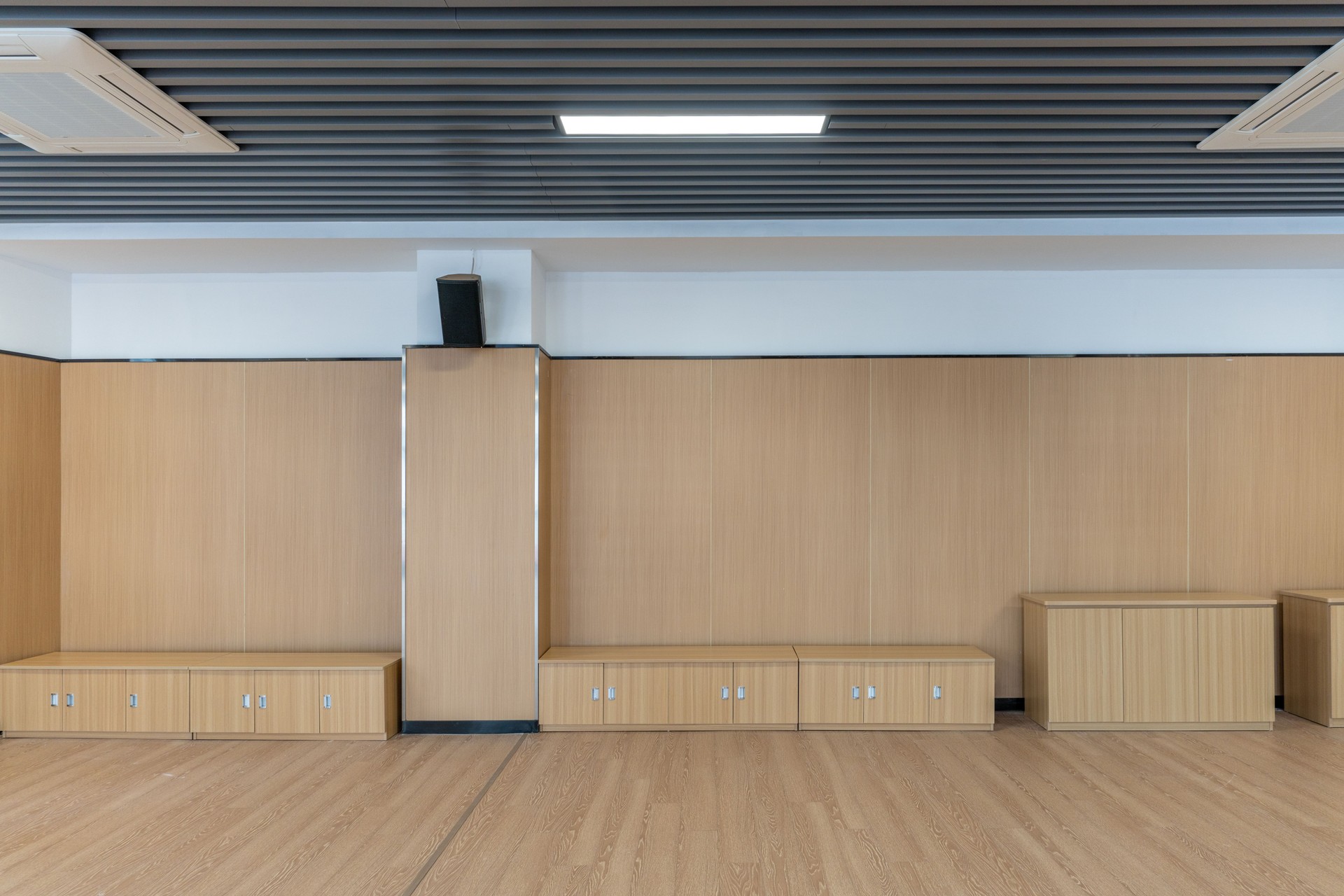Wood floor, wall and cabinets in the empty dance room