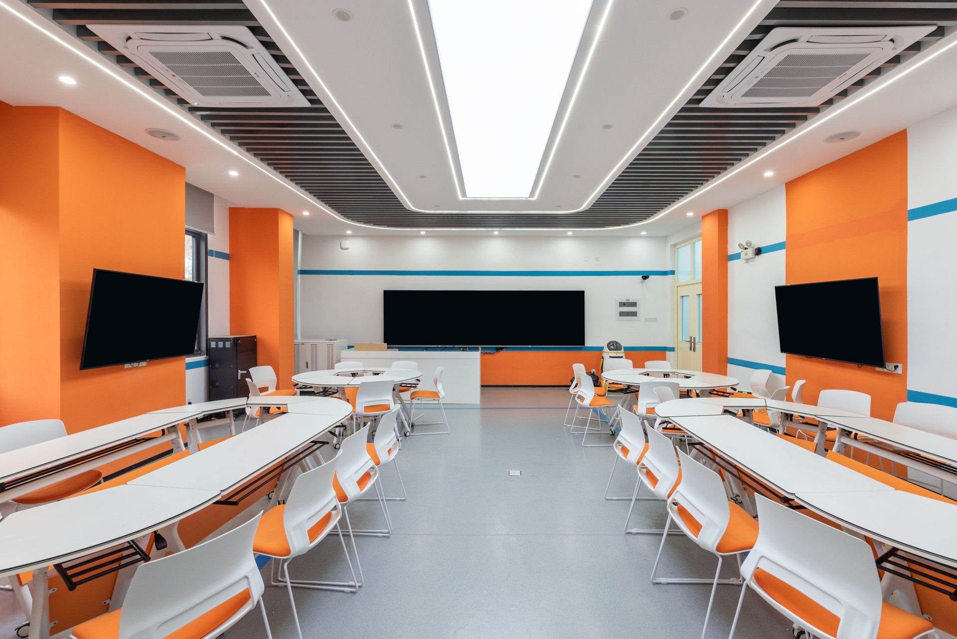 Multimedia classroom with colorful decoration and tables and chairs of different shapes
